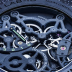 Close-up of a Panerai LAB-01 skeleton watch showing intricate mechanical gears, black case elements, and silver internal components.